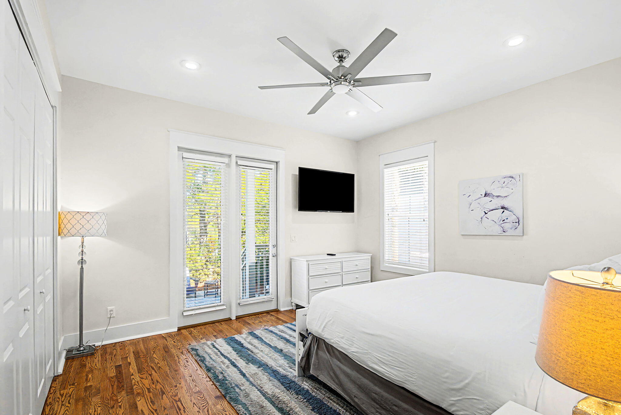 306 Beach Bike Way Inlet Beach, FL 32461 - Photo 21 of 33 a bedroom with a large bed a flat tv screen and a dresser