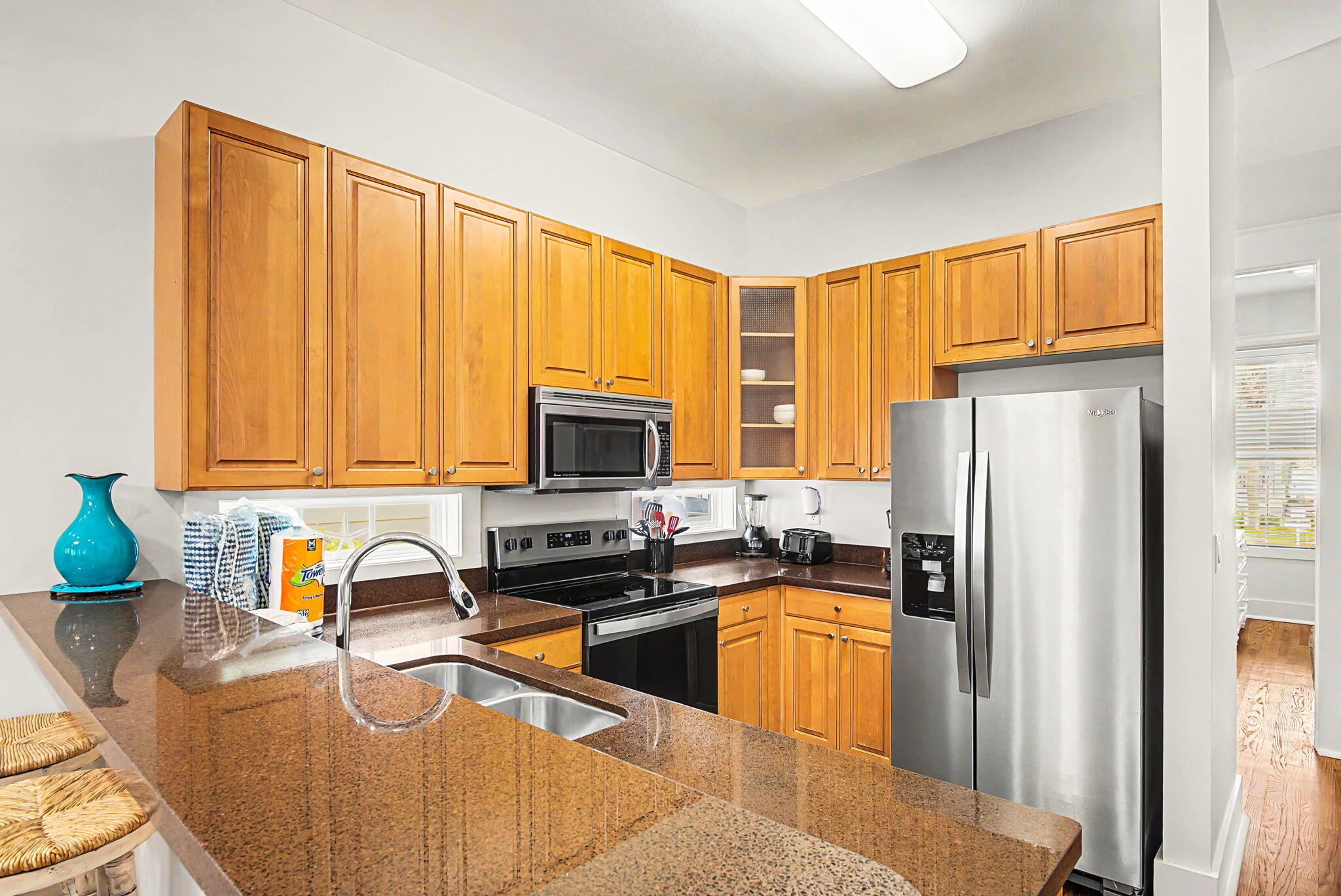 306 Beach Bike Way Inlet Beach, FL 32461 - Photo 9 of 33 a kitchen with stainless steel appliances granite countertop a refrigerator a stove a sink dishwasher and a microwave with wooden cabinets
