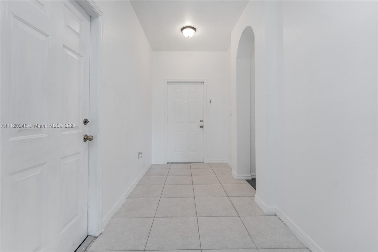 19064 Southwest 319th Street Homestead, FL 33030 - Photo 2 of 15 a view of an empty room