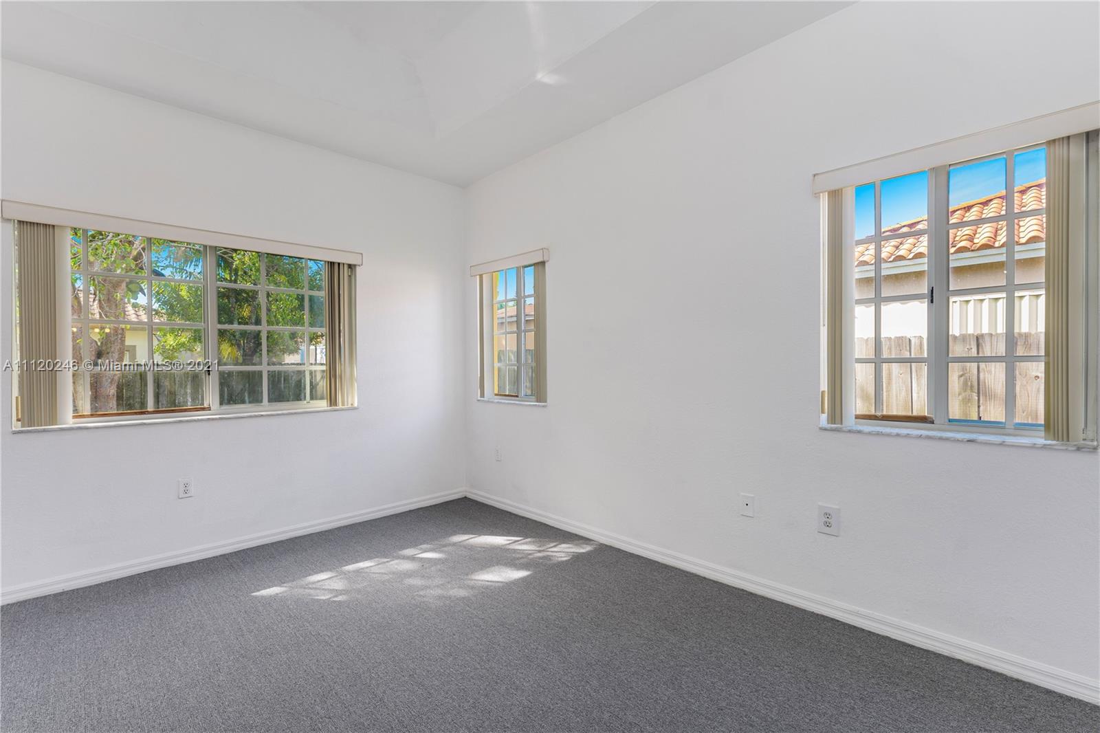 19064 Southwest 319th Street Homestead, FL 33030 - Photo 10 of 15 a view of an empty room with a window