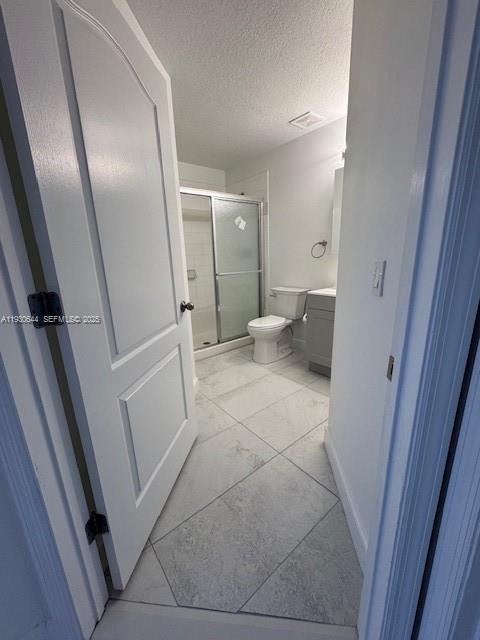 11033 Legacy Boulevard, Unit 302 Palm Beach Gardens, FL 33410 - Photo 14 of 28 a bathroom with a sink and mirror with toilet