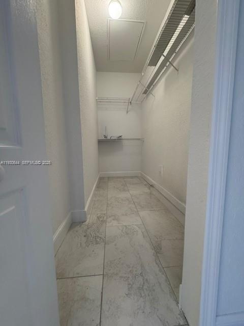 11033 Legacy Boulevard, Unit 302 Palm Beach Gardens, FL 33410 - Photo 17 of 28 a view of a room with racks on the wall