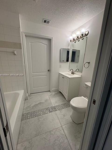 11033 Legacy Boulevard, Unit 302 Palm Beach Gardens, FL 33410 - Photo 18 of 28 a bathroom with a sink a toilet and mirror