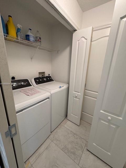 11033 Legacy Boulevard, Unit 302 Palm Beach Gardens, FL 33410 - Photo 19 of 28 a utility room with dryer and washer