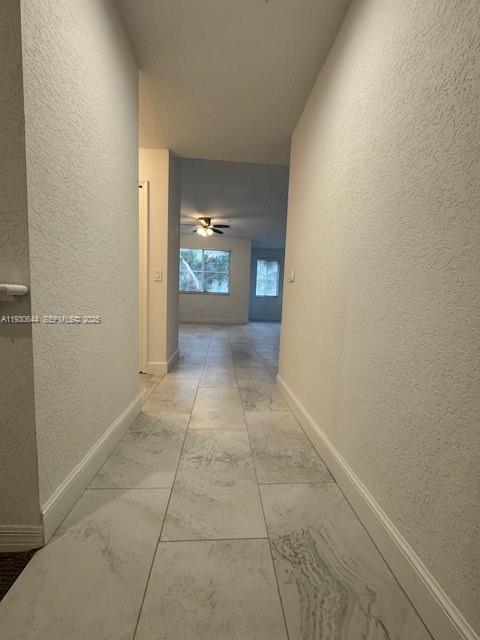 11033 Legacy Boulevard, Unit 302 Palm Beach Gardens, FL 33410 - Photo 21 of 28 a view of a hallway with bathroom