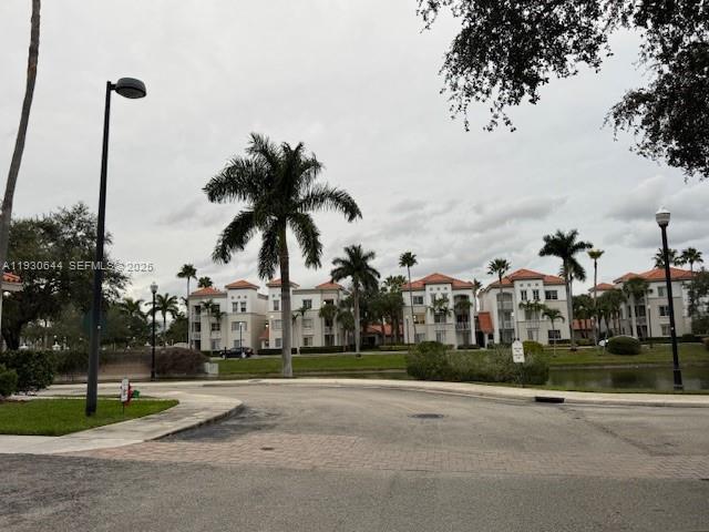 11033 Legacy Boulevard, Unit 302 Palm Beach Gardens, FL 33410 - Photo 26 of 28 a view of a park with swings