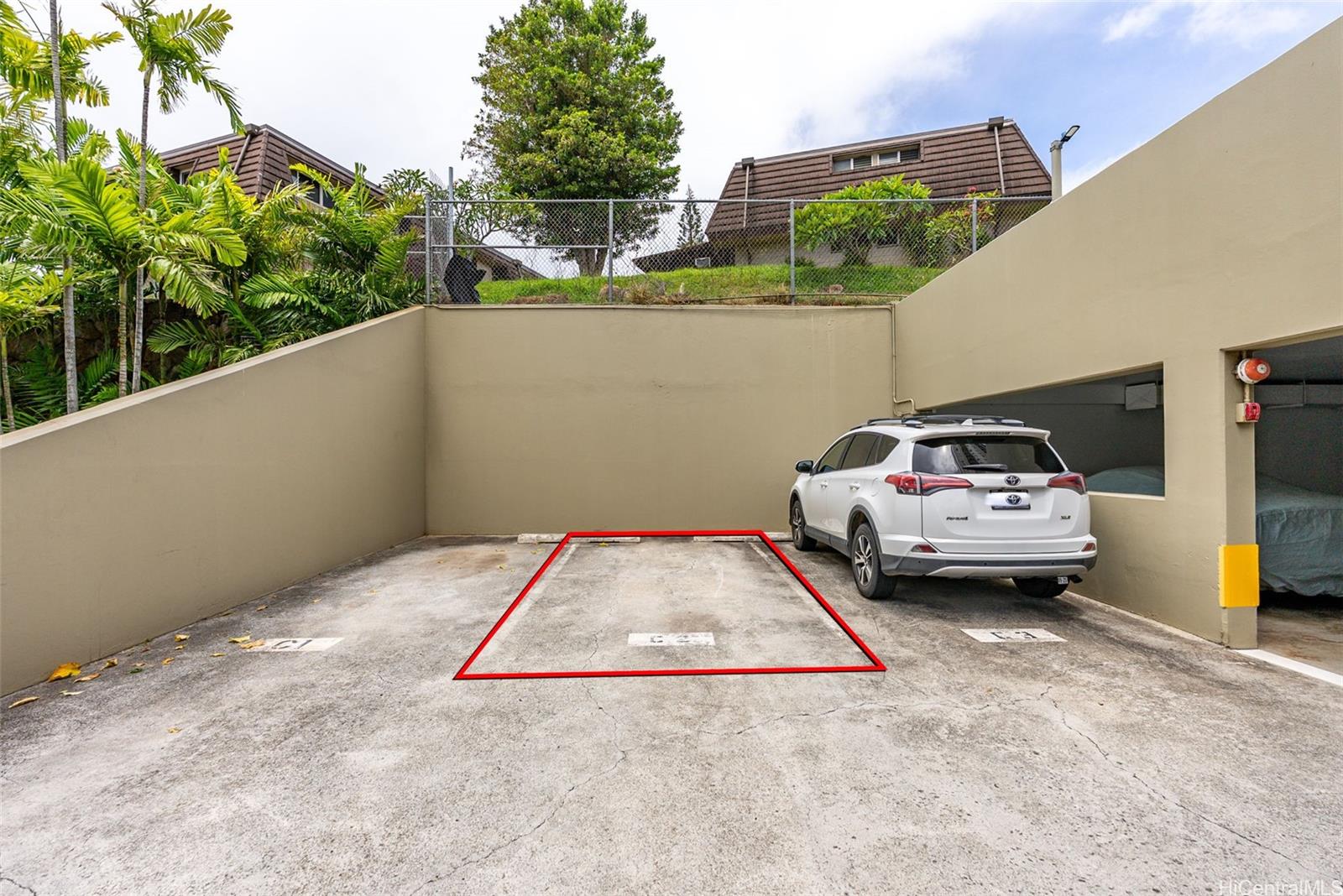 98-1038 Moanalua Road, Unit 1502 Aiea, HI 96701 - Photo 19 of 20 a white car parked in front of a building