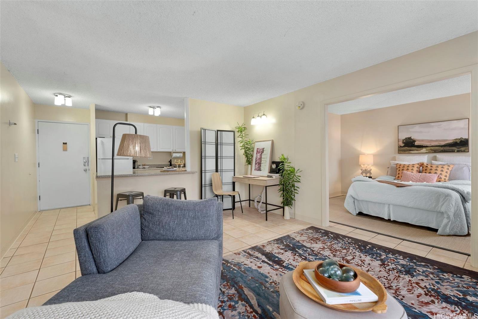 98-1038 Moanalua Road, Unit 1502 Aiea, HI 96701 - Photo 8 of 20 a living room with furniture and a table