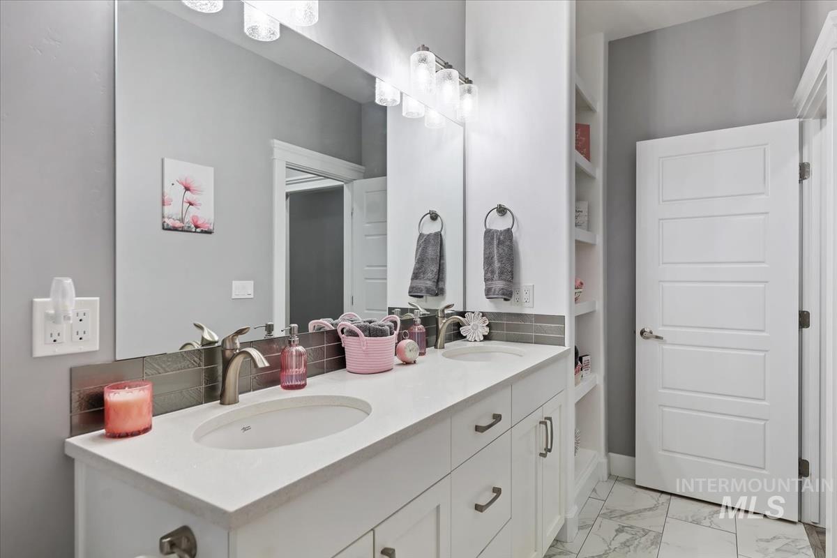 189 South Devon Avenue Star, ID 83669 - Photo 25 of 42 Bathroom with double vanity and light marble finish floors