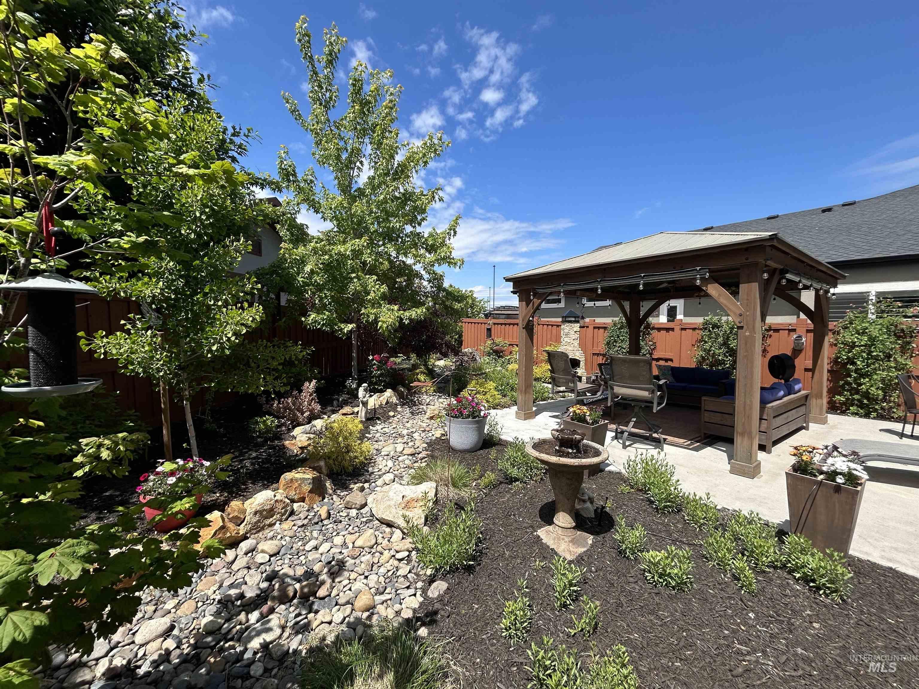 189 South Devon Avenue Star, ID 83669 - Photo 29 of 42 Fenced backyard featuring a gazebo, outdoor lounge area, and a patio area