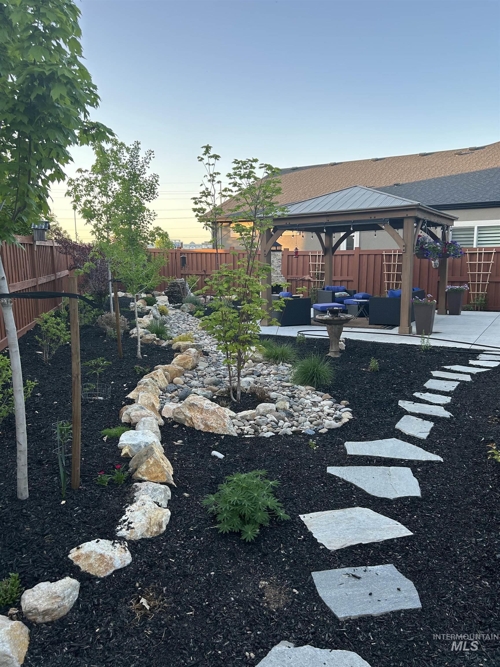 189 South Devon Avenue Star, ID 83669 - Photo 30 of 42 Fenced backyard featuring a gazebo, a patio area, and outdoor lounge area
