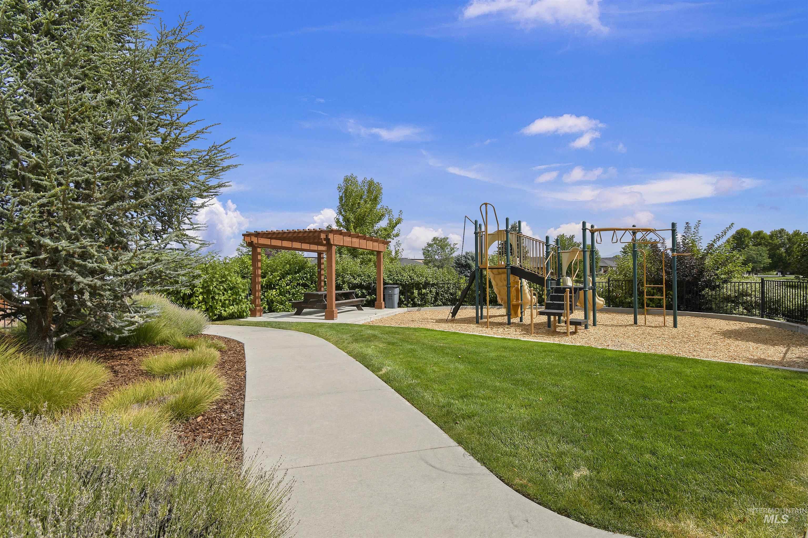 189 South Devon Avenue Star, ID 83669 - Photo 36 of 42 Community playground with a patio, a pergola, and a lawn
