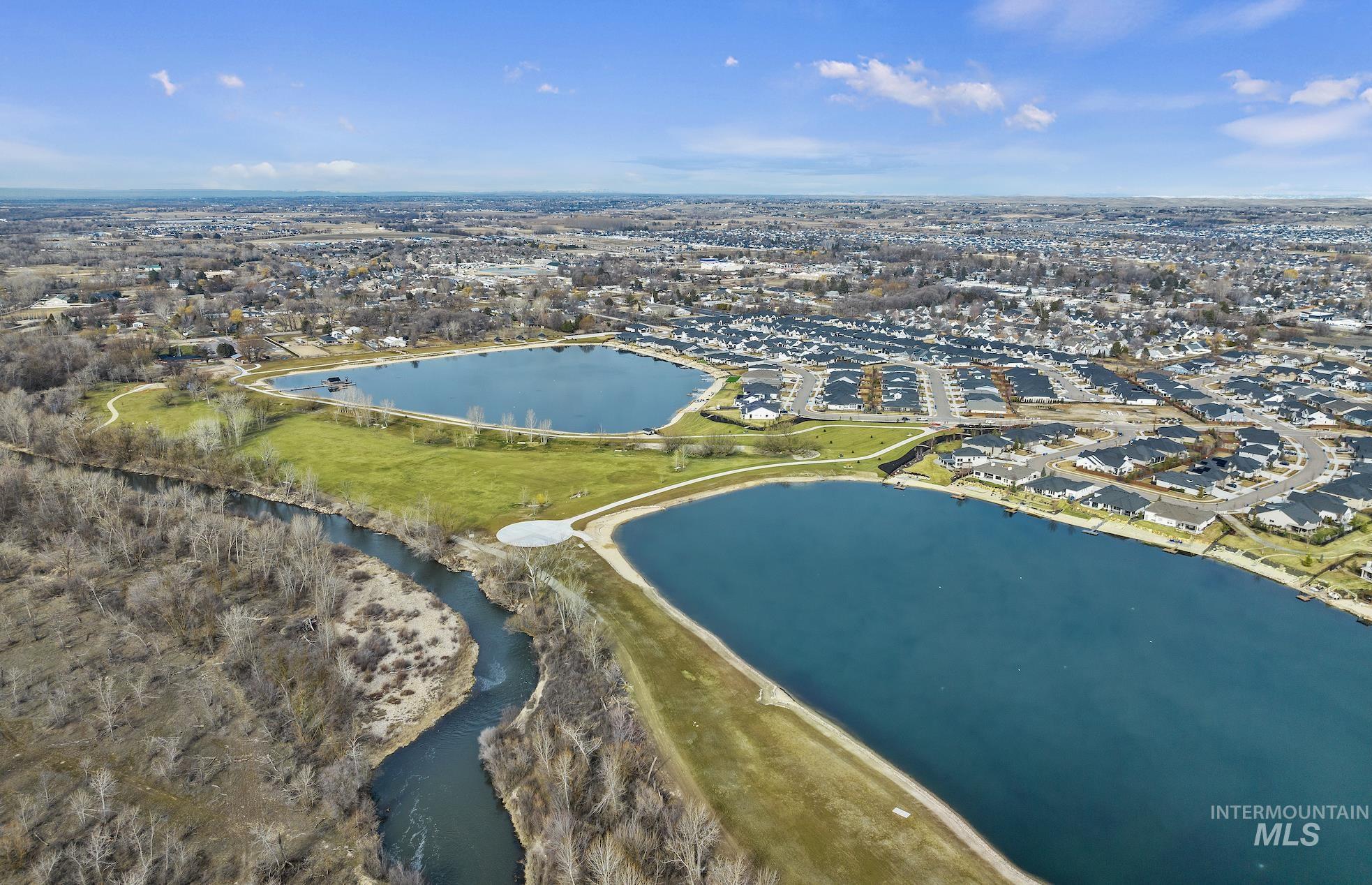 189 South Devon Avenue Star, ID 83669 - Photo 40 of 42 Aerial view of property and surrounding area with a large body of water and nearby suburban area