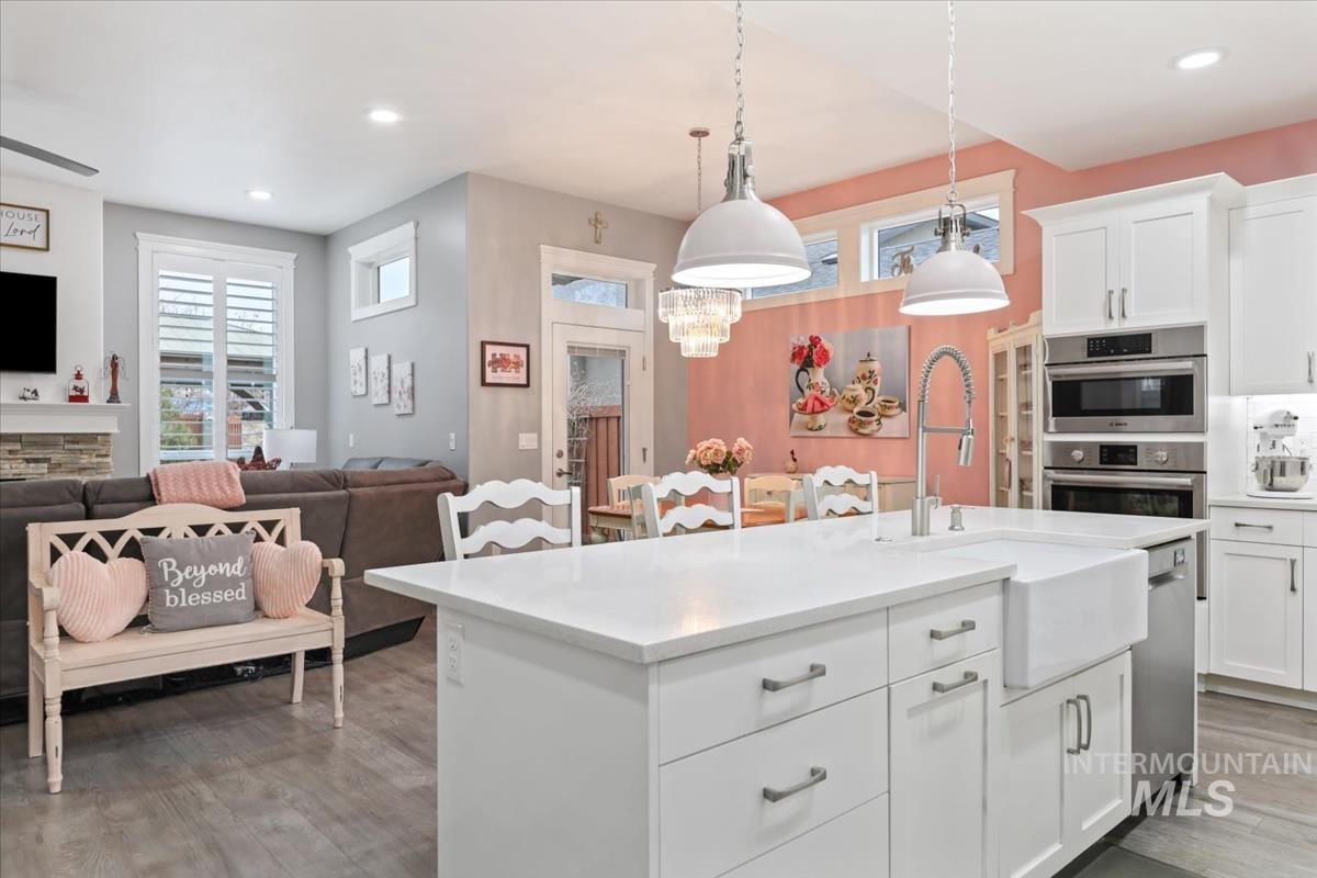 189 South Devon Avenue Star, ID 83669 - Photo 7 of 42 Kitchen featuring white cabinetry, pendant lighting, plenty of natural light, recessed lighting, and a kitchen island with sink