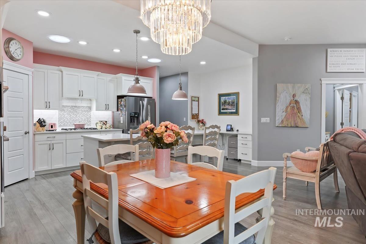 189 South Devon Avenue Star, ID 83669 - Photo 9 of 42 Dining area featuring light wood-style floors, recessed lighting, and a chandelier
