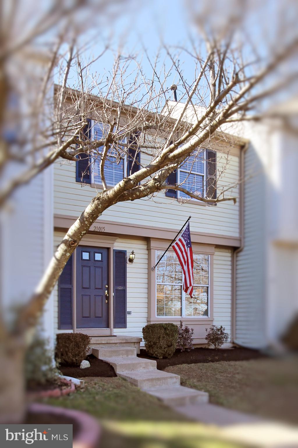 21015 Coach House Square Ashburn, VA 20147 - Photo 1 of 43 a front view of a house