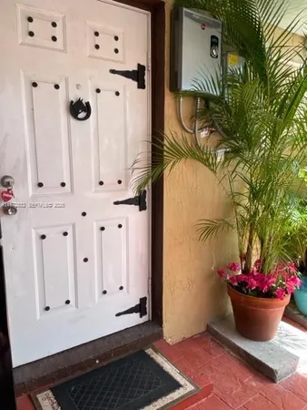 a bathroom with a potted plant