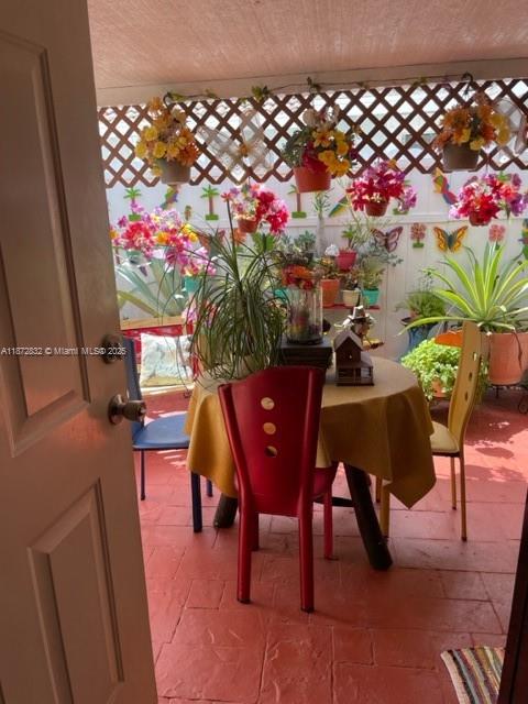 14188 Southwest 145th Place, Unit 1 Miami, FL 33186 - Photo 2 of 6 a view of a dining room with furniture and wooden floor