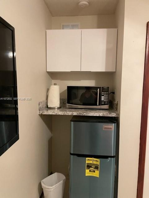 14188 Southwest 145th Place, Unit 1 Miami, FL 33186 - Photo 4 of 6 a view of washer and dryer