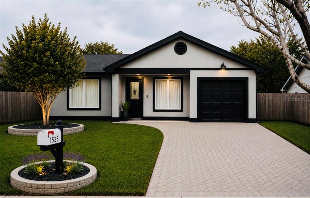 1525 Kestrel Way Brandon, FL 33511 - Photo 1 of 48 a front view of a house with garden