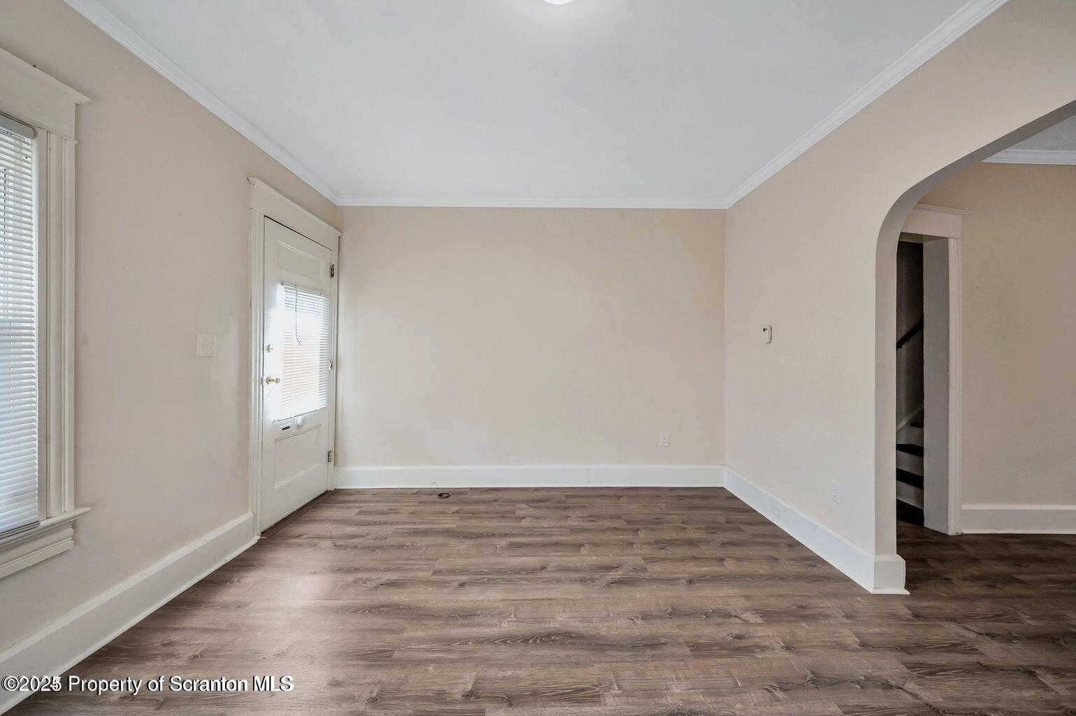 811 Grandview Street Scranton, PA 18509 - Photo 9 of 13 an empty room with wooden floor and windows