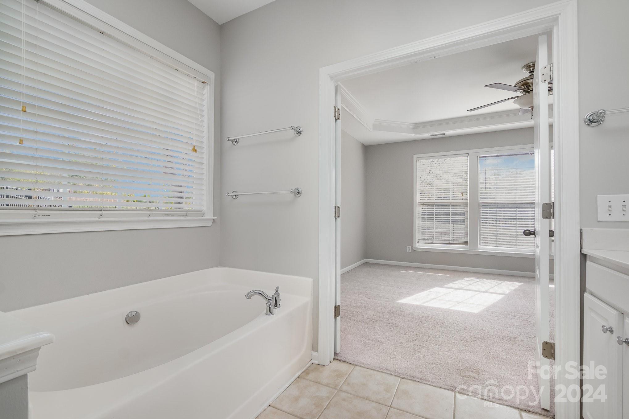 2532 Coltsgate Road Waxhaw, NC 28173 - Photo 12 of 21 a bathroom with a bathtub and a shower