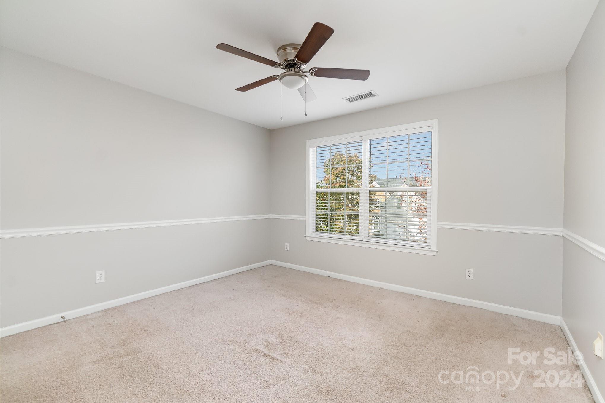 2532 Coltsgate Road Waxhaw, NC 28173 - Photo 14 of 21 an empty room with a window and a fan