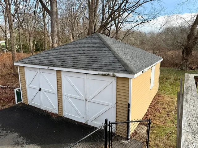 a view of a wooden deck and a yard