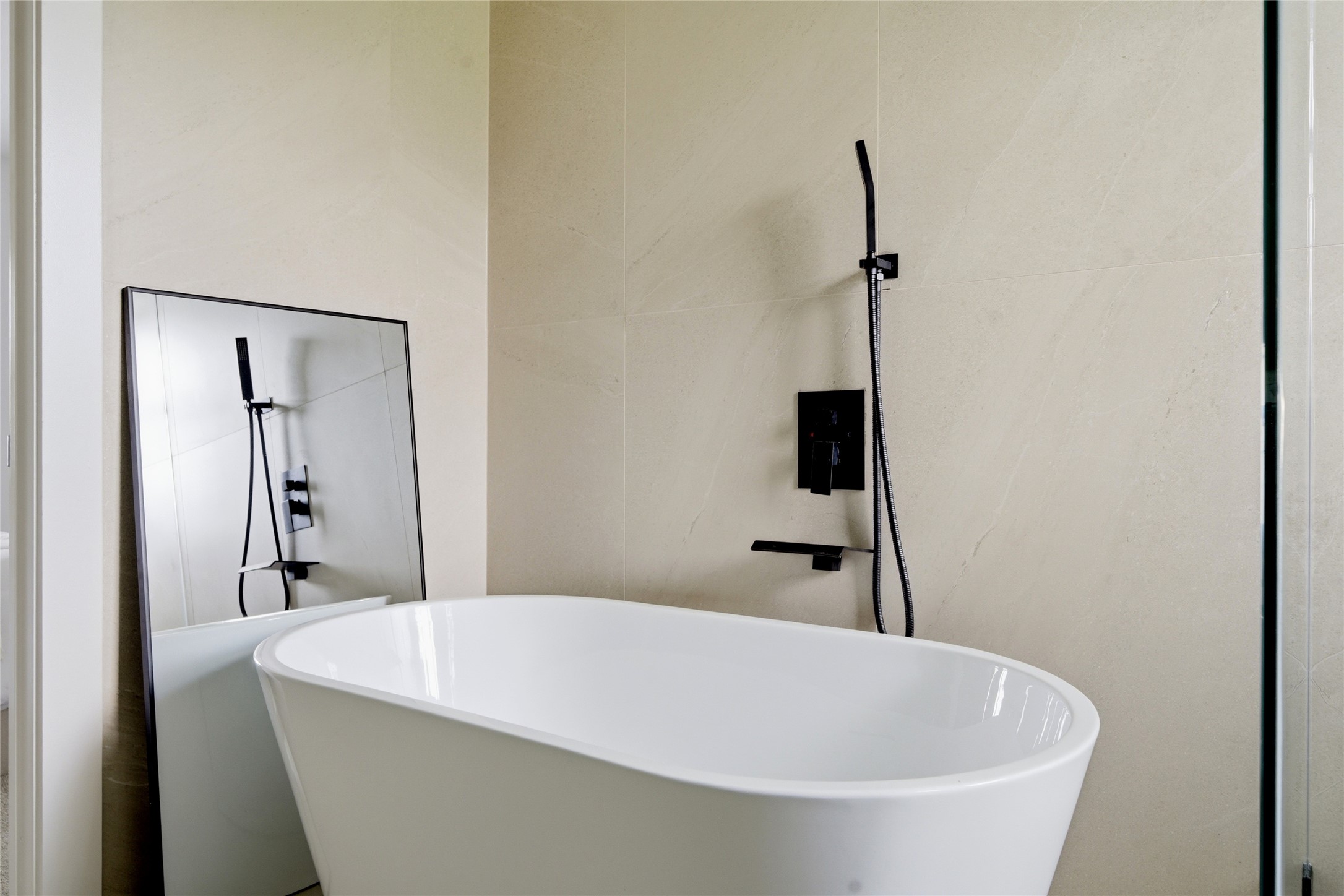 5114 Keystone Street Houston, TX 77021 - Photo 9 of 27 Spa-style bathroom with freestanding soaking tub and rain shower
