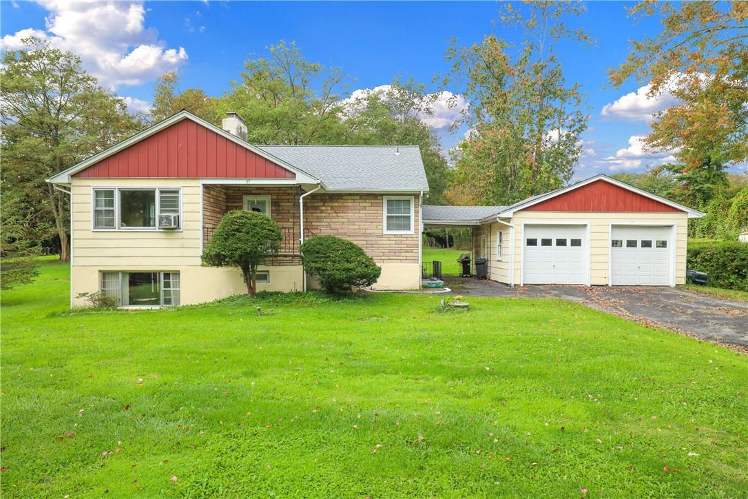 a view of a house with a yard