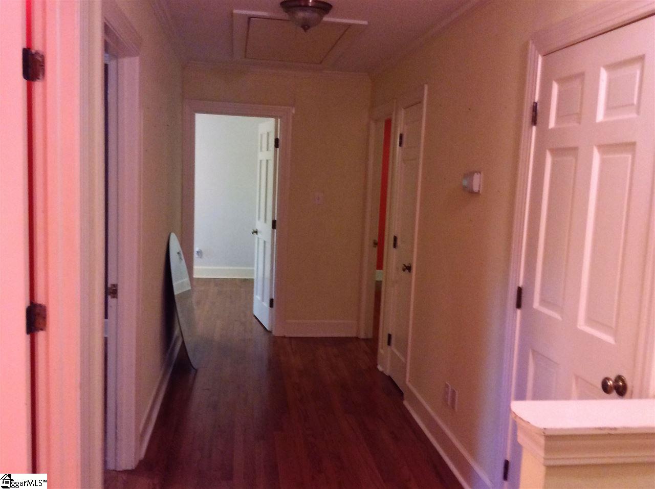 103 Bagwell Farm Road Spartanburg, SC 29302 - Photo 18 of 32 Spacious hallway with two closets and pull-down attic access.