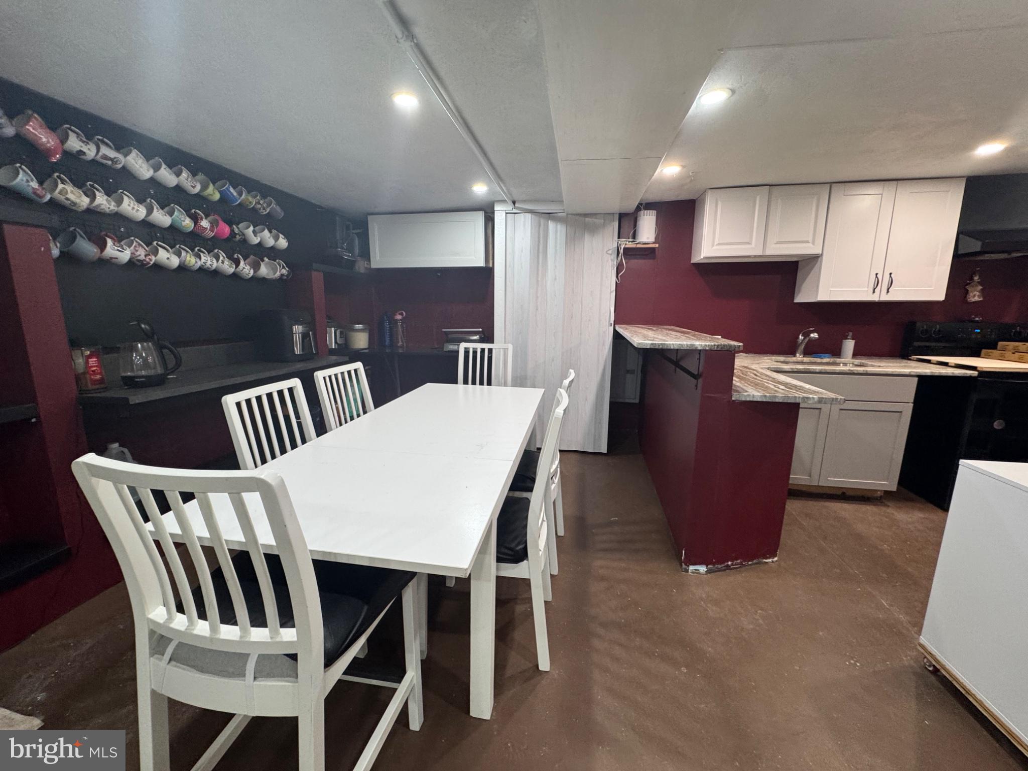 2727 Durham Road Doylestown, PA 18902 - Photo 22 of 32 a kitchen with stainless steel appliances kitchen island granite countertop a dining table chairs and a refrigerator