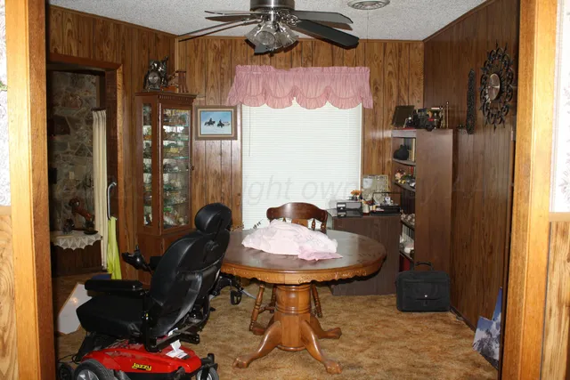 a view of a street with a big yard