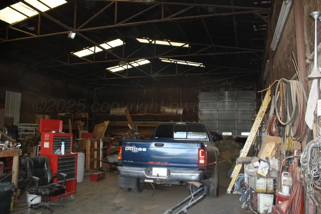 a spacious bedroom with a bed and a fireplace