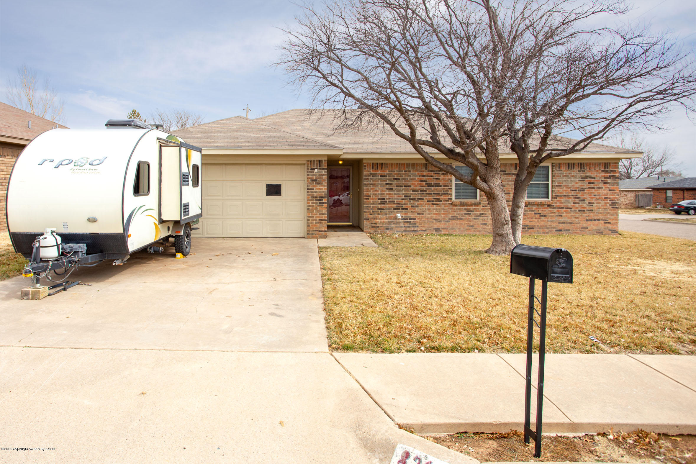 8213 Wrangler Trail Amarillo, TX 79110 - Photo 1 of 20 a front view of a house with parking area