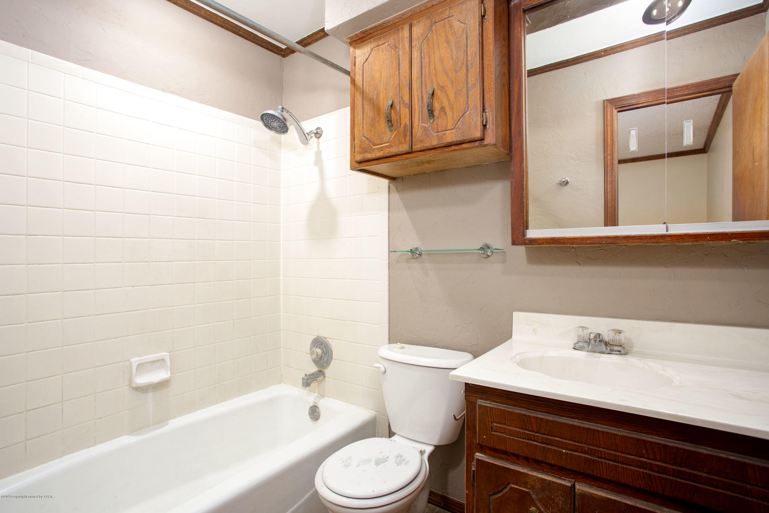 8213 Wrangler Trail Amarillo, TX 79110 - Photo 12 of 20 a bathroom with a sink a toilet and shower
