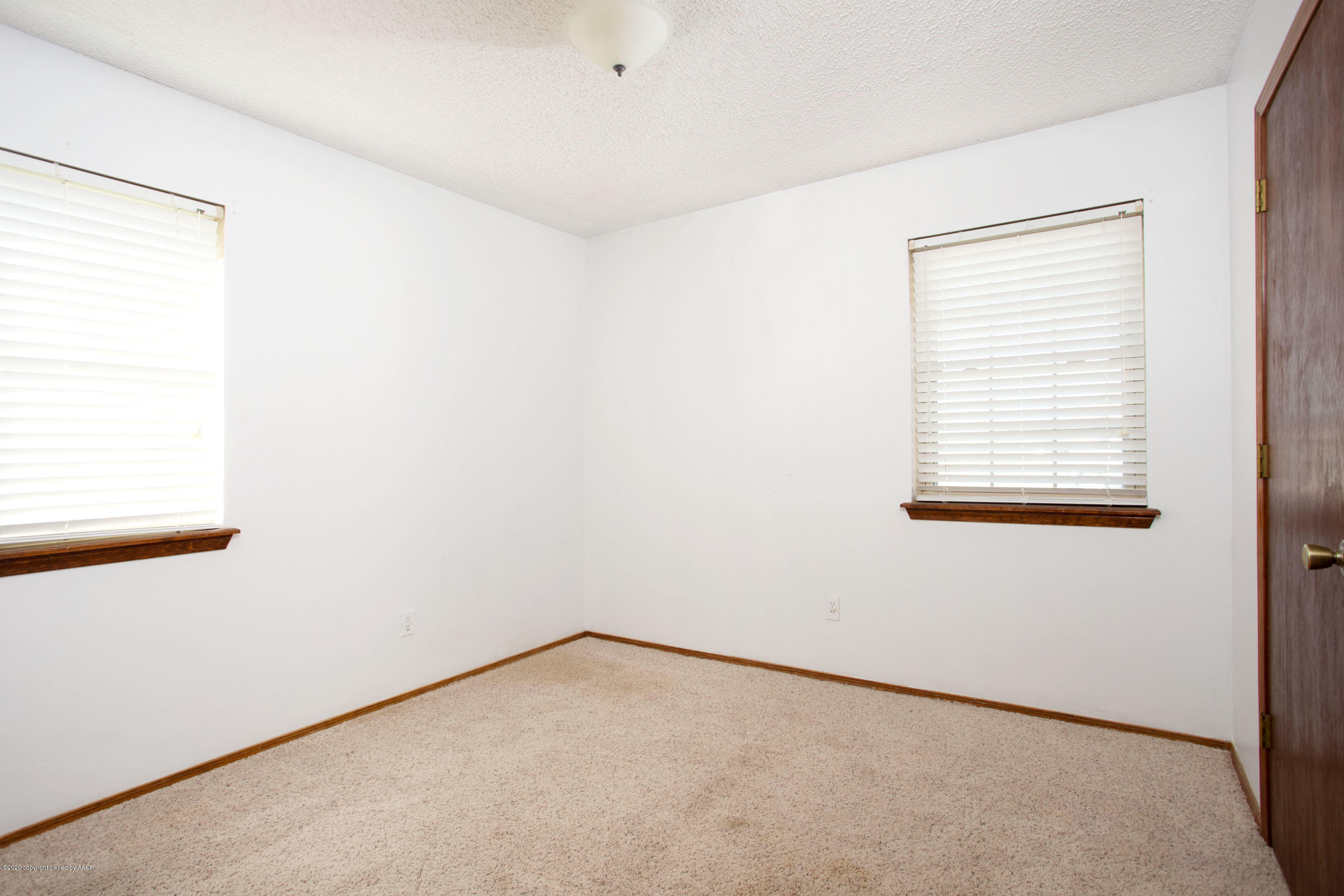 8213 Wrangler Trail Amarillo, TX 79110 - Photo 14 of 20 an empty room with a window