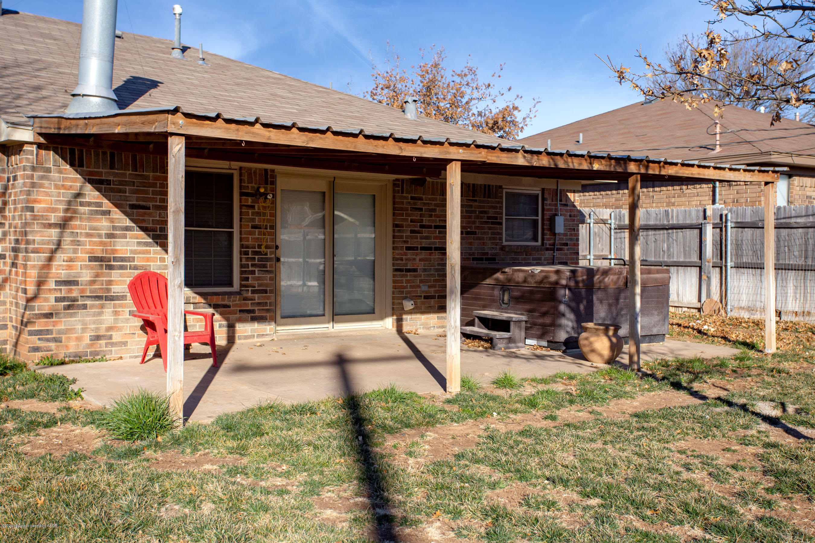 8213 Wrangler Trail Amarillo, TX 79110 - Photo 19 of 20 a view of a house with backyard sitting area and porch