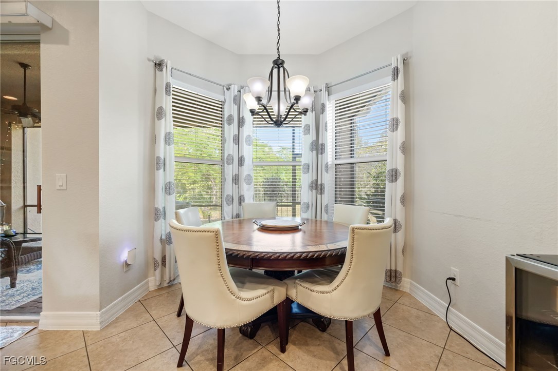 10117 Silver Maple Court Fort Myers, FL 33913 - Photo 14 of 49 a dining room with furniture window and outside view