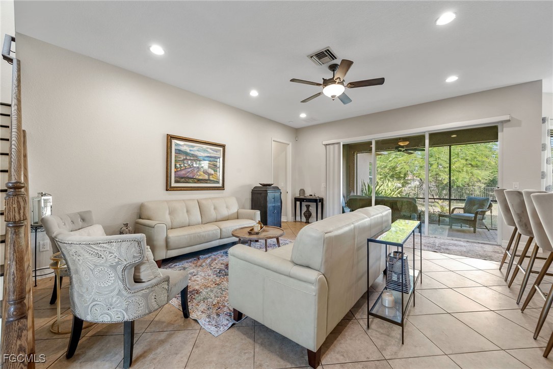 10117 Silver Maple Court Fort Myers, FL 33913 - Photo 15 of 49 a living room with furniture and a large window