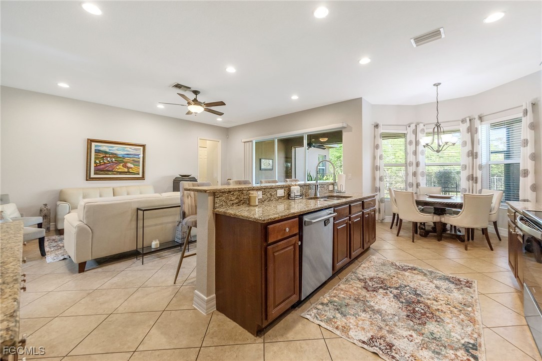 10117 Silver Maple Court Fort Myers, FL 33913 - Photo 2 of 49 a large white kitchen with a large window