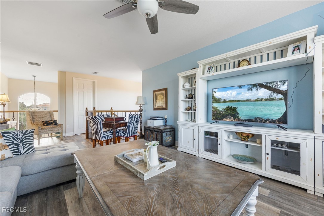 10117 Silver Maple Court Fort Myers, FL 33913 - Photo 25 of 49 a living room with furniture and a flat screen tv