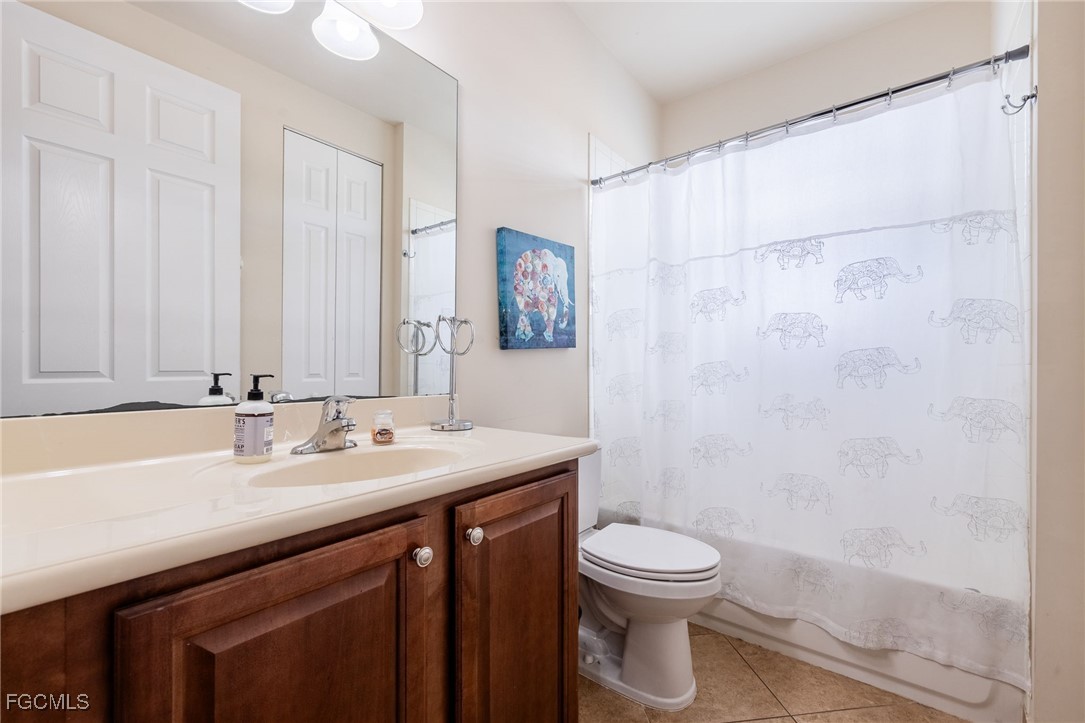 10117 Silver Maple Court Fort Myers, FL 33913 - Photo 29 of 49 a bathroom with a sink a toilet and shower
