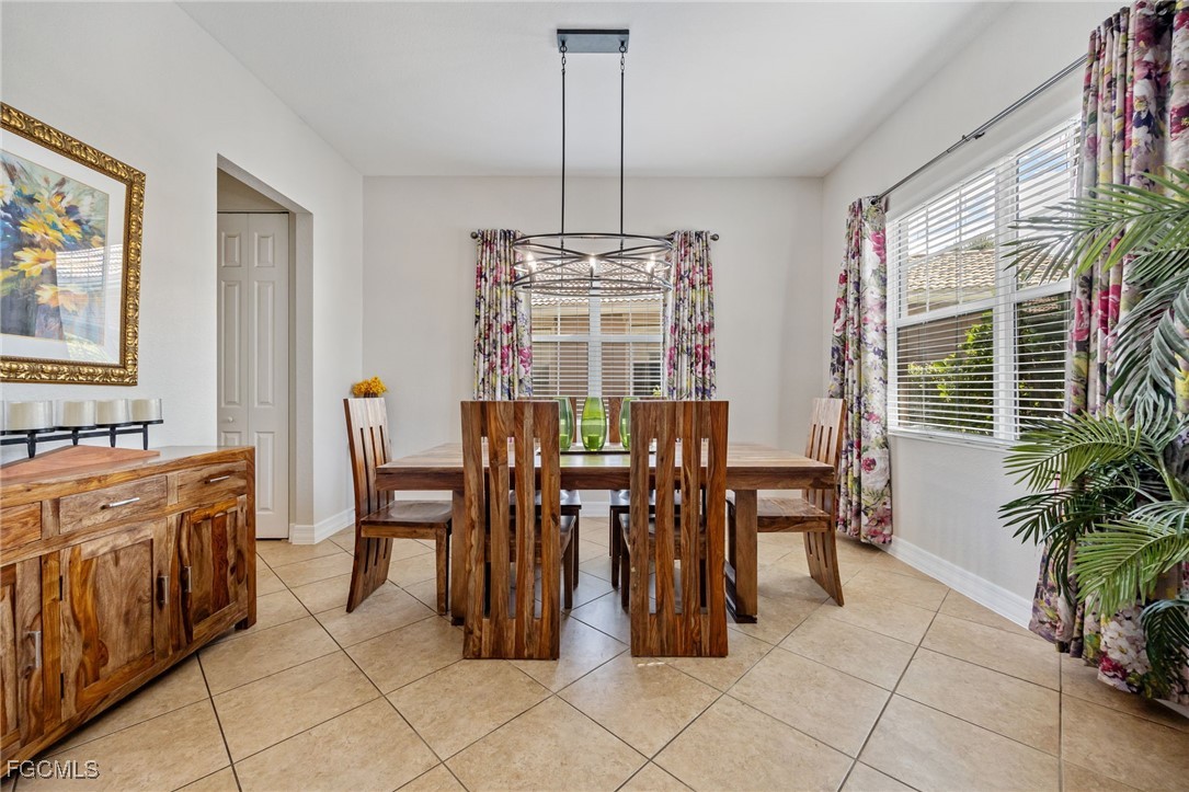 10117 Silver Maple Court Fort Myers, FL 33913 - Photo 3 of 49 a view of a dining room with furniture window and outside view