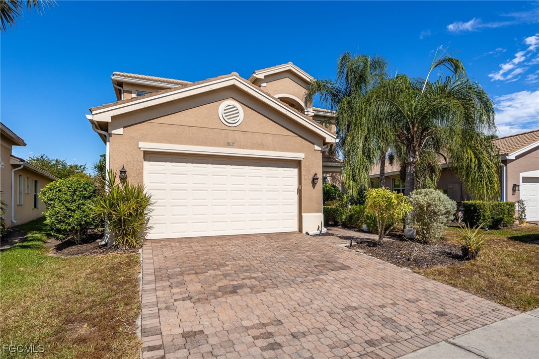 10117 Silver Maple Court Fort Myers, FL 33913 - Photo 9 of 49 a view of a house with a small yard and plants