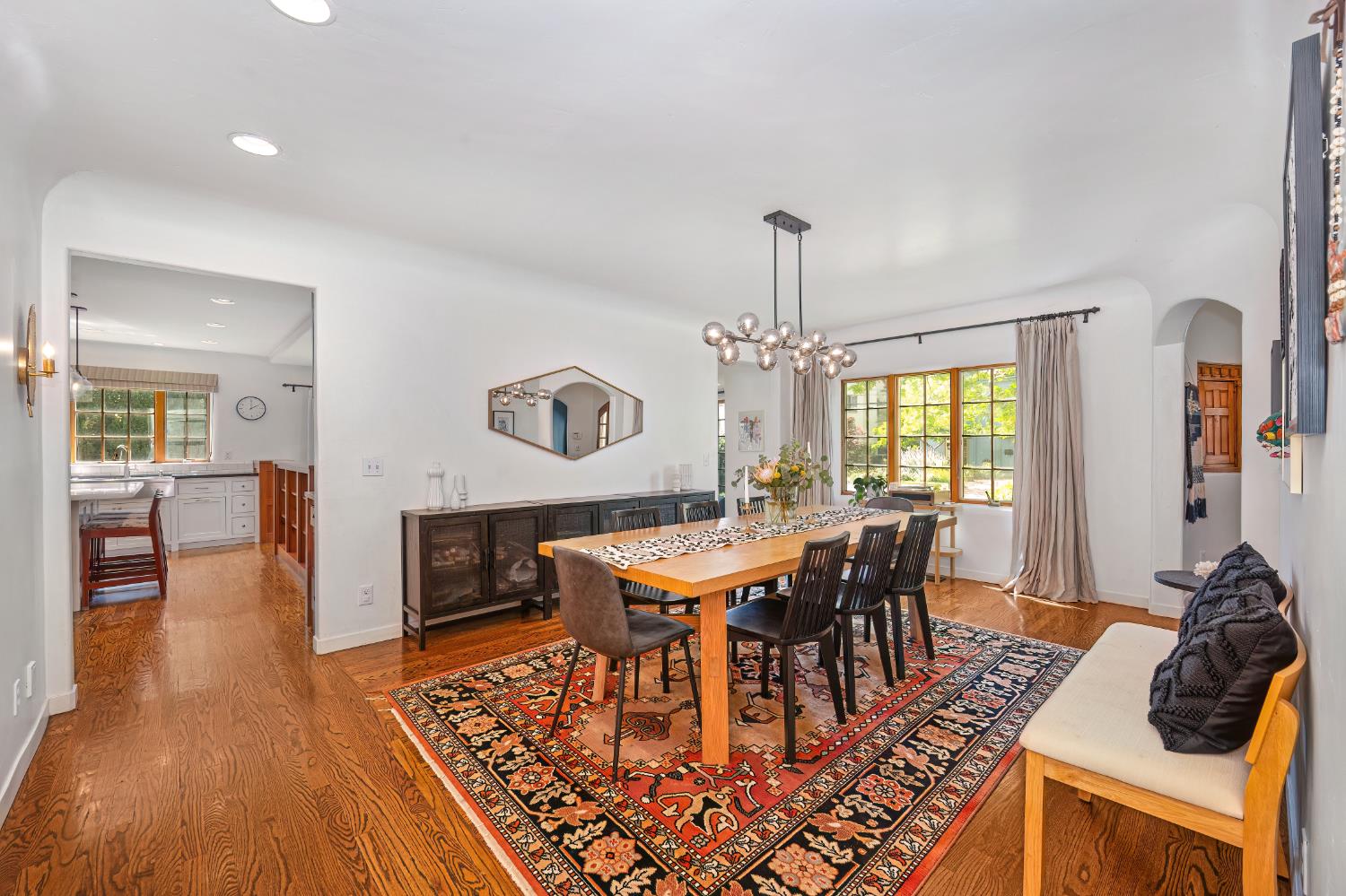 3501 Cutter Way Sacramento, CA 95818 - Photo 10 of 89 a dining room with furniture a chandelier and wooden floor