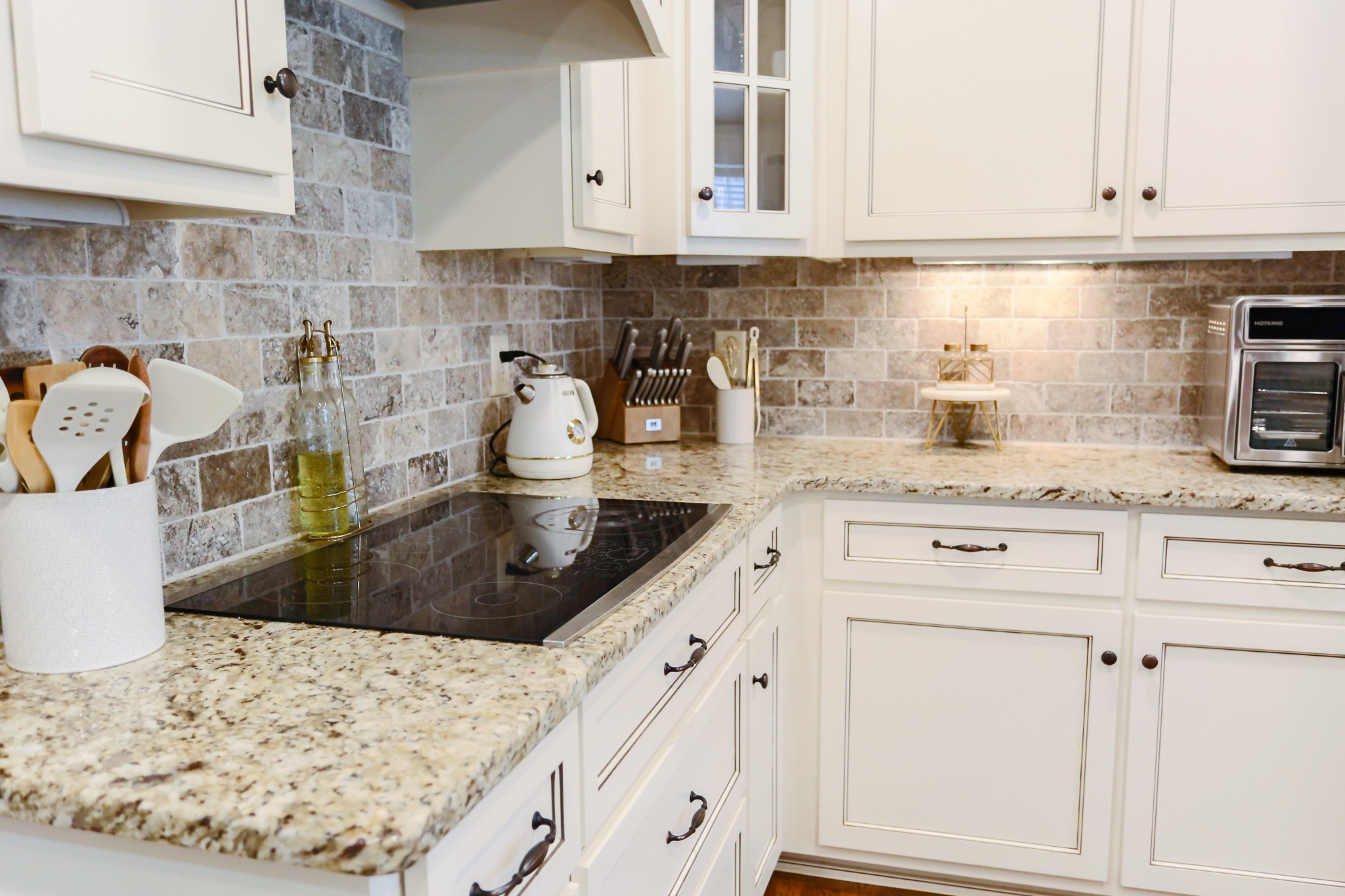 1700 Zevon Court Spring Hill, TN 37174 - Photo 22 of 71 a kitchen with white cabinets and a sink