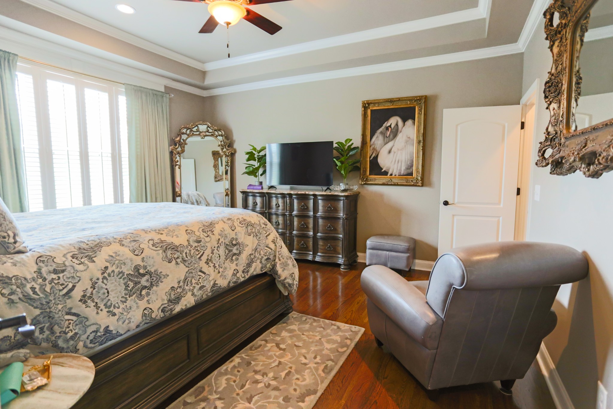 1700 Zevon Court Spring Hill, TN 37174 - Photo 29 of 71 a bedroom with a bed couch and a chandelier