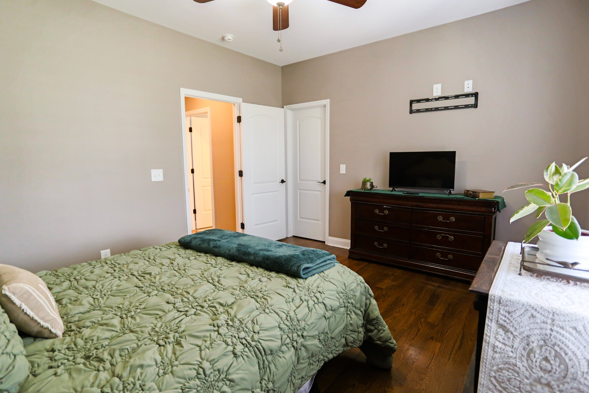 1700 Zevon Court Spring Hill, TN 37174 - Photo 39 of 71 a bedroom with a bed and a flat tv screen on dresser