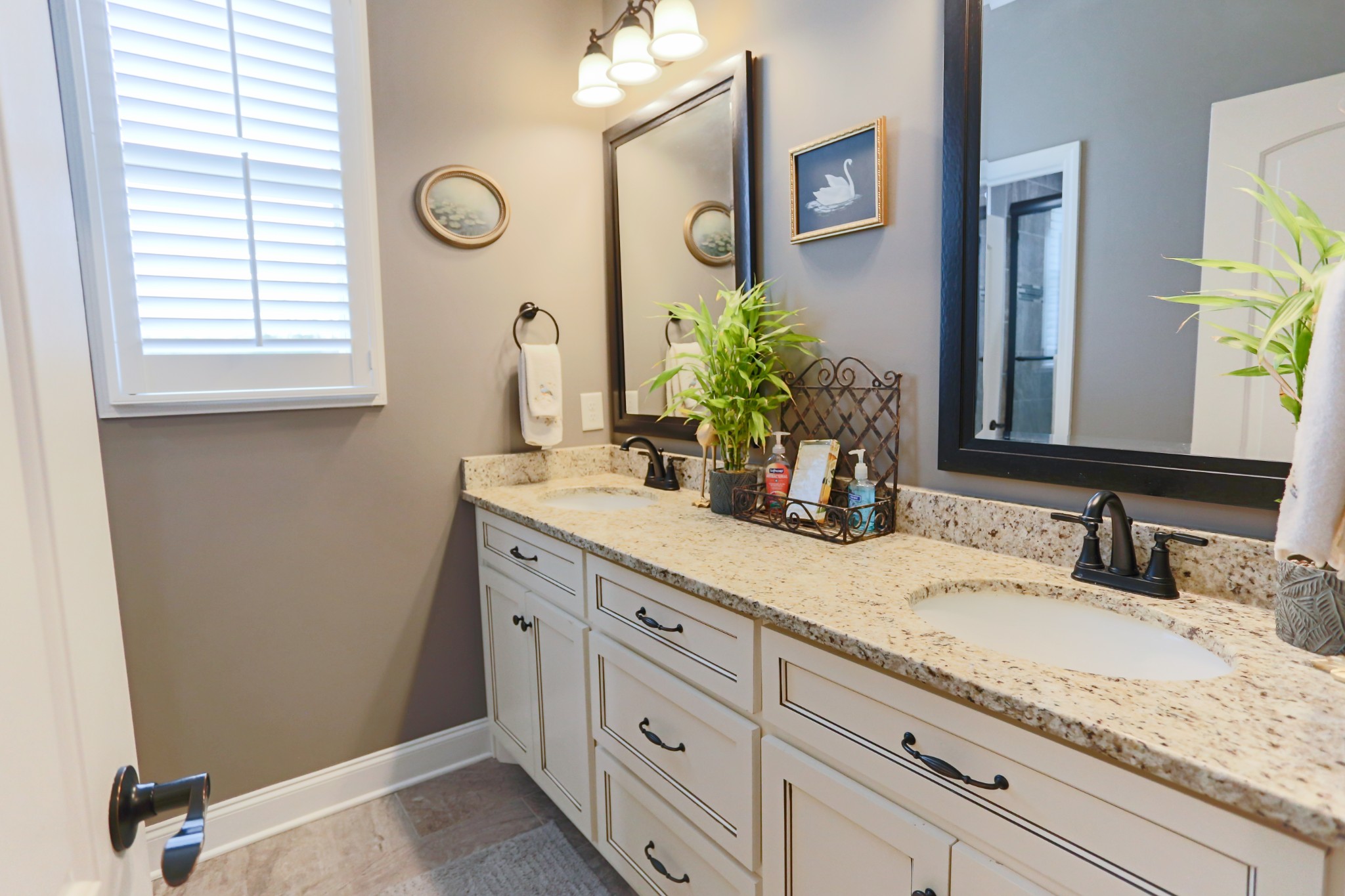 1700 Zevon Court Spring Hill, TN 37174 - Photo 40 of 71 a bathroom with a granite countertop sink and a mirror